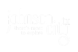 Mossy green circle with writing: johnson city tx there's more to explore